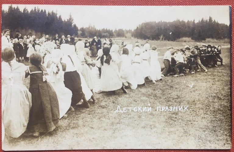 Item #H1147 Detsky Praznik - Real Photo Postcard of a Russian youth group having a tug of war, ca. 1900s. N/a.