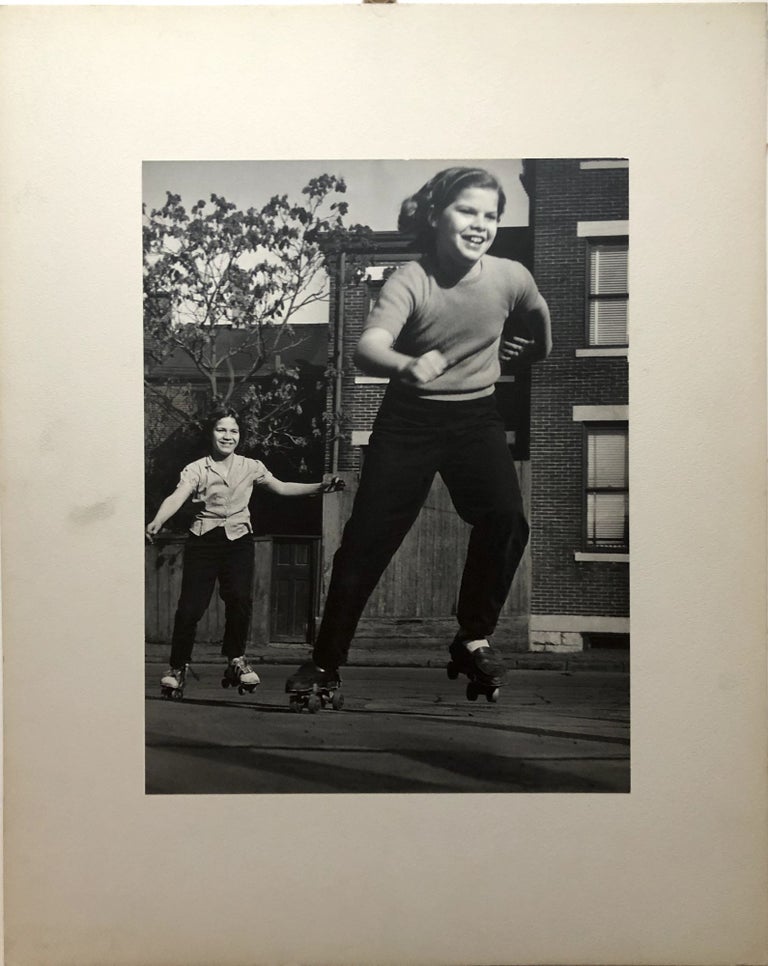 Item #H15045 Original 13.5 x 10" Ca. 1960s silver gelatin print of two girls roller skating, Pittsburgh ca. 1960. John L. Alexandrowicz.