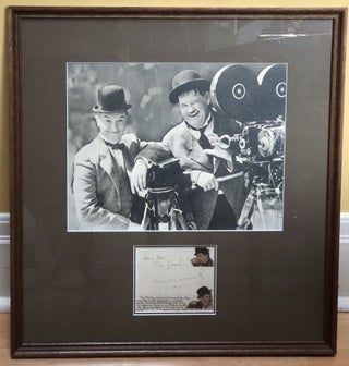 Item #H18261 Autographs of Laurel and Hardy in 1940, matted and framed with photo. Stan Laurel,...