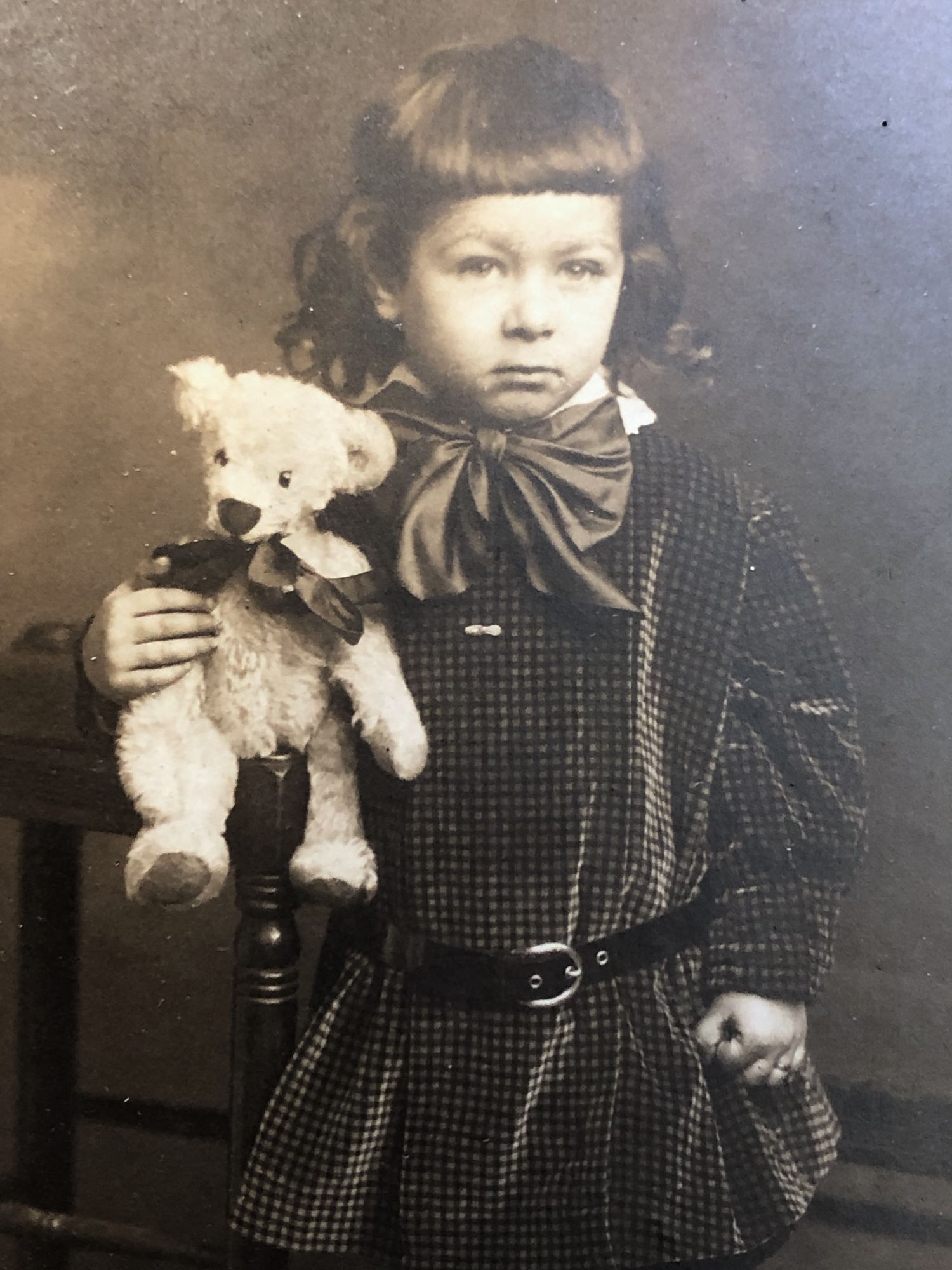 Charming 1910s photograph portrait of young girl with her Teddy Bear