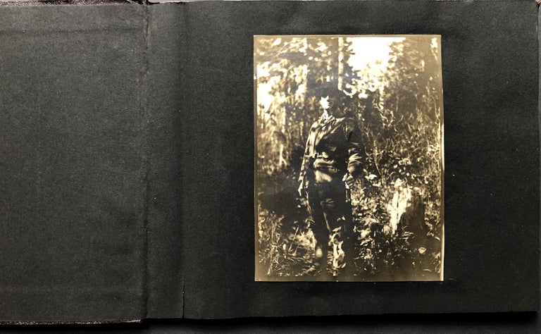 Item #H25287 Small ca. 1910 photo album of a hunting trip, possibly Montana: fishing, black bears, elk, etc.