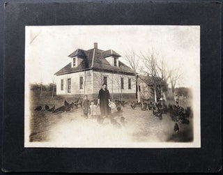 Item #H25288 Ca. 1910s photo of a mother & two young children in front of farmhouse feeding large...